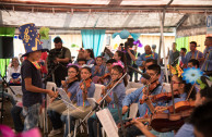 Children of the hostel participate as a director in charge of the OSEMAP orchestra.