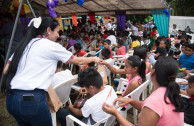 Volunteers from the GEAP delivering the gifts to the children of the refuge.