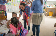 Children from the shelter of the La Industria farm, Escuintla receive the musical greeting from the members of OSEMAP.